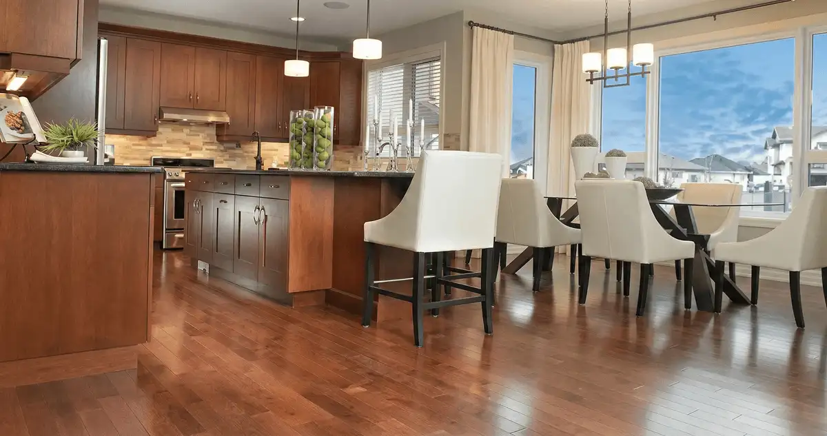 A modern kitchen with professionally installed wood flooring in Orlando, FL