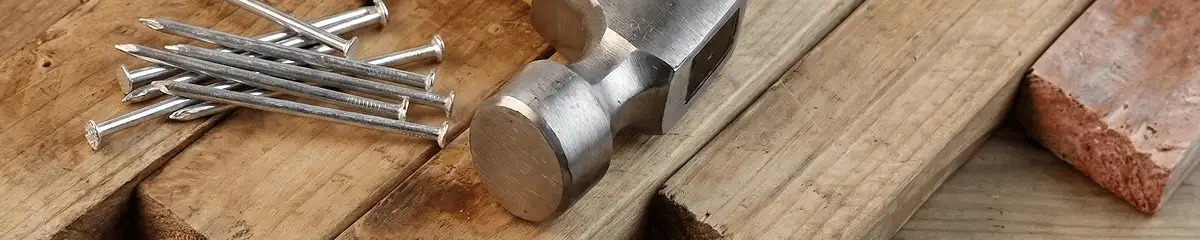 Hammer and nails on hardwood flooring boards in Orlando, FL