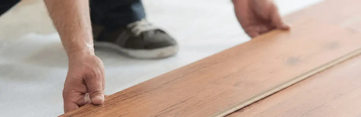A professional installing laminate flooring in Orlando, FL
