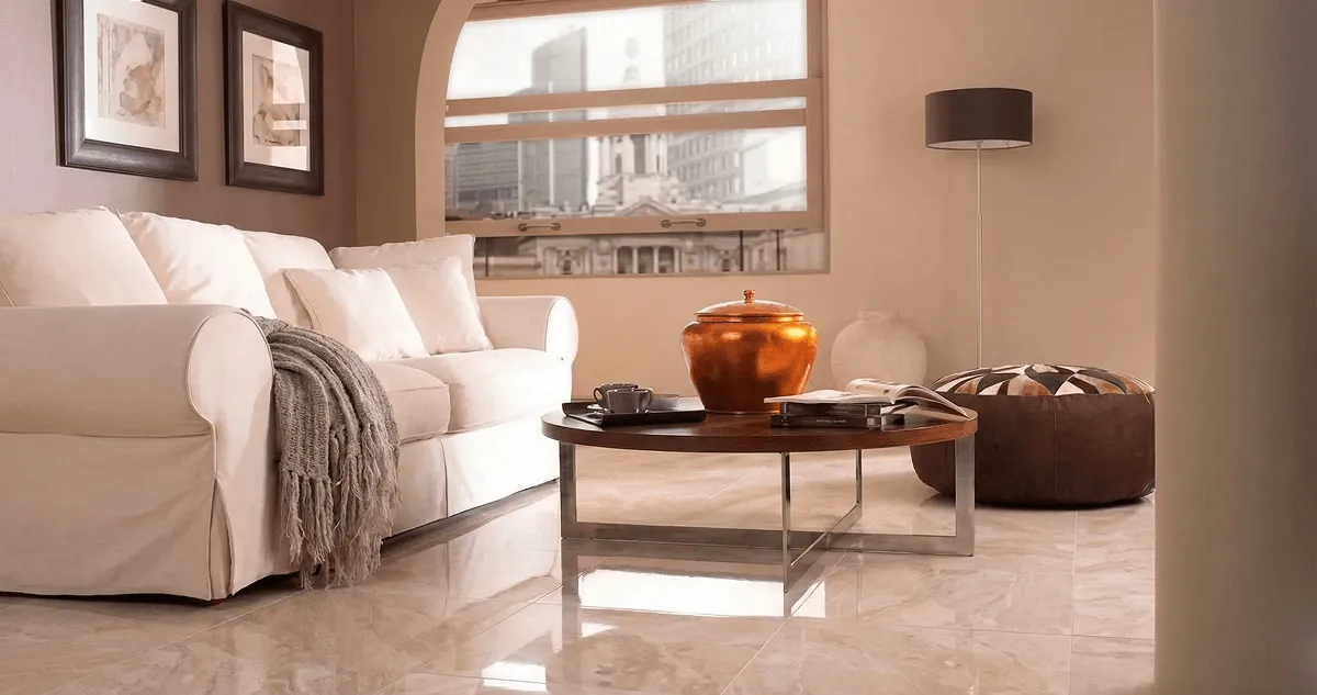 Modern living room with professionally installed marble flooring, a beige sofa, coffee table in Orlando, FL