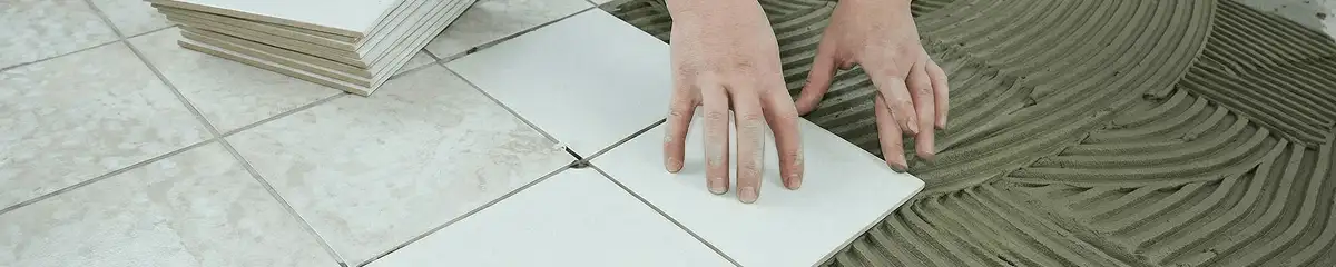 Professional installing white tile floors in Orlando, FL