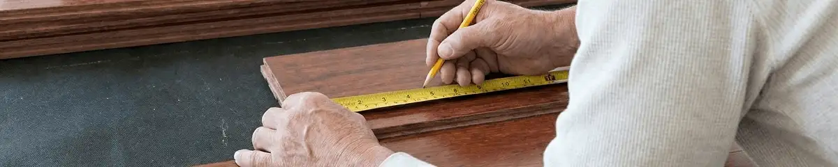 A professional installing wood flooring in Orlando, FL